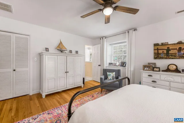 a living room with furniture a window and a fireplace