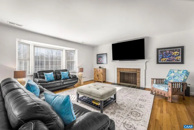 a kitchen with granite countertop a stove a sink and a microwave