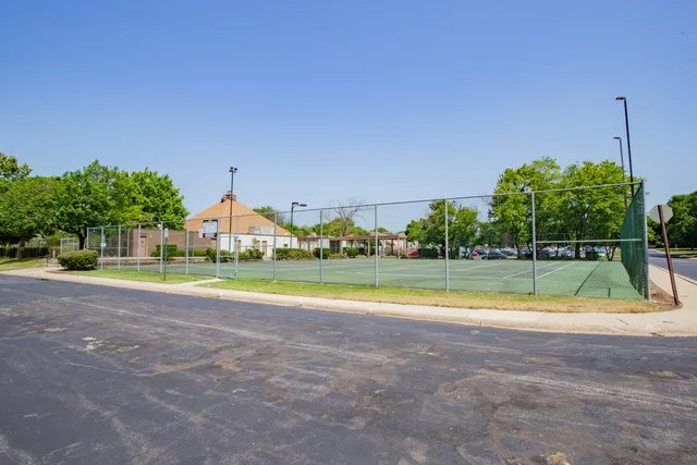 a view of swimming pool is middle in the middle of a yard