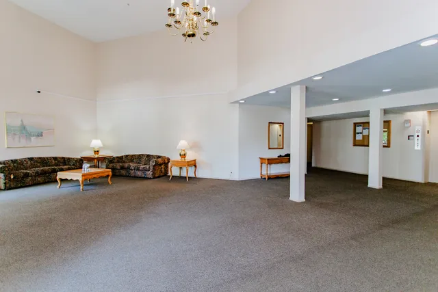 a view of a livingroom with furniture and ceiling fan