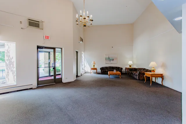 a view of a livingroom with furniture and a window