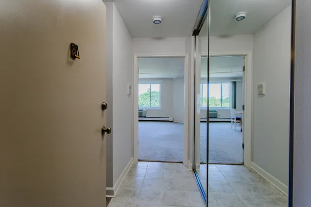 wooden view of a livingroom from a hallway
