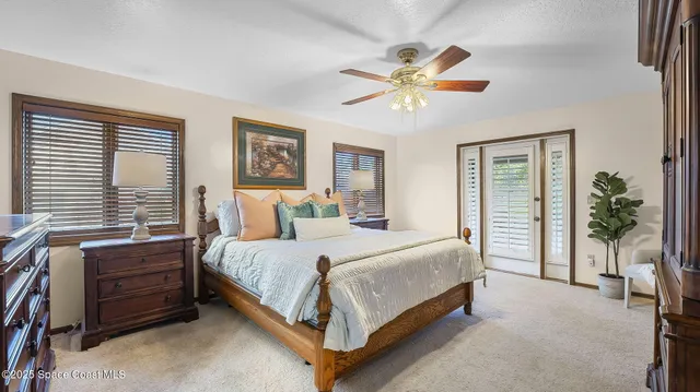 a bathroom with a sink a large mirror and a toilet