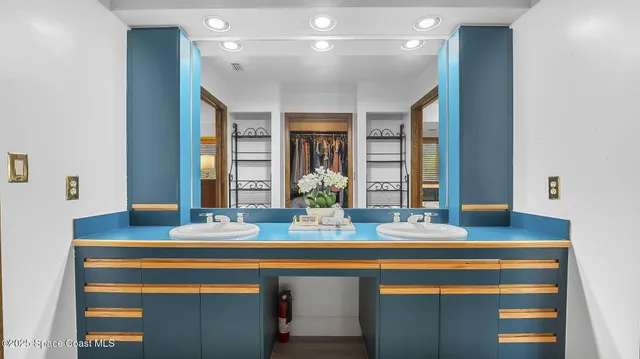 a white bed in a bathroom