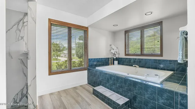 a view of a kitchen with a table and chairs