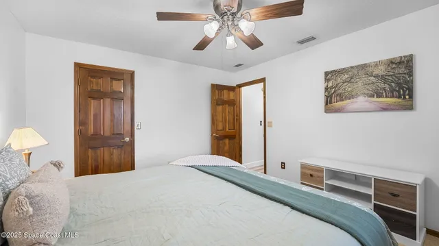 a view of a living room with furniture floor to ceiling window
