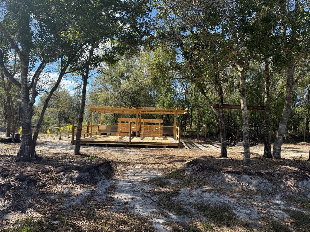 17618 Northwest 286th Street Okeechobee, FL 34972 - Photo 2 of 18 a view of a backyard with large trees