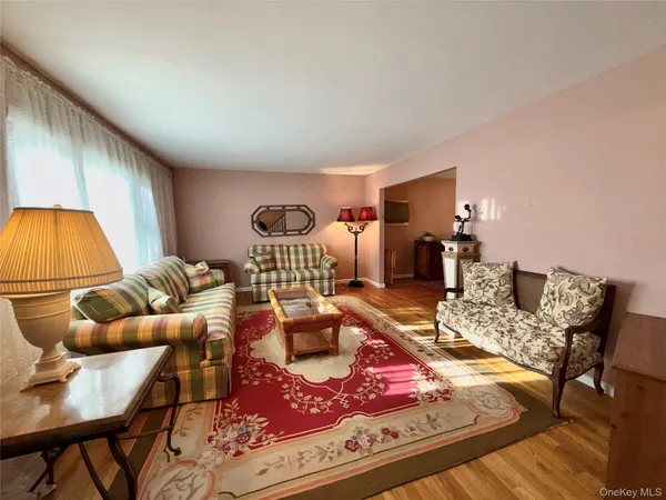 a living room with furniture and a table
