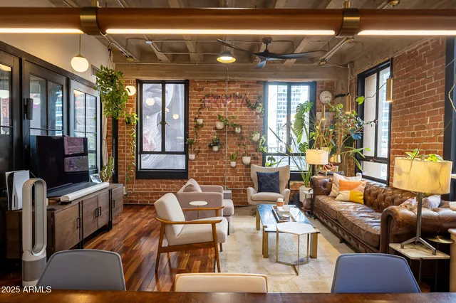 a kitchen with stainless steel appliances kitchen island granite countertop a sink and cabinets