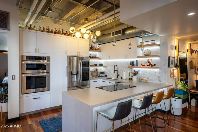 a kitchen that has a lot of cabinets in it