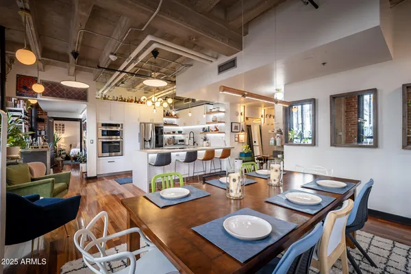 a kitchen with a table and chairs in it