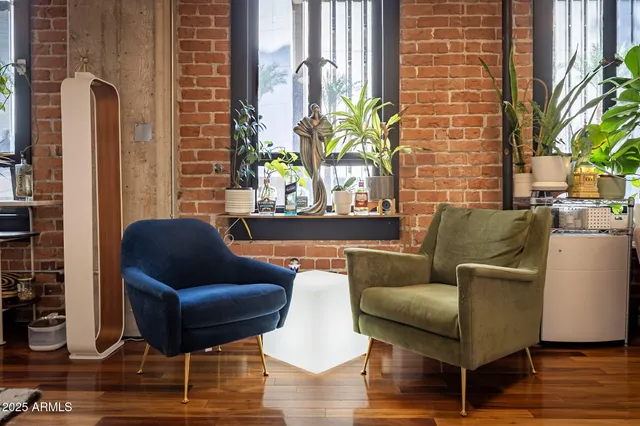 a bathroom with a sink a large mirror and a toilet