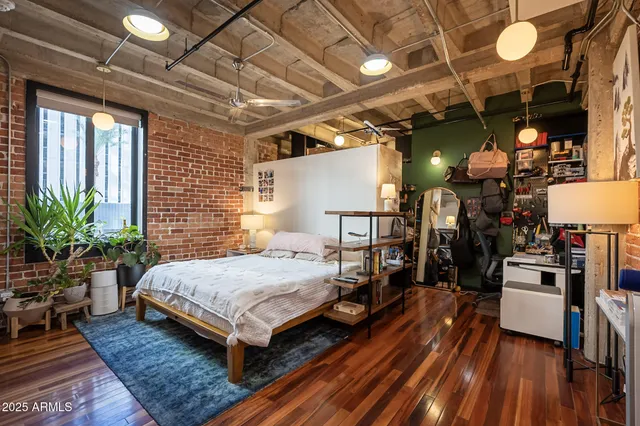 a kitchen with stainless steel appliances kitchen island granite countertop a refrigerator and a stove