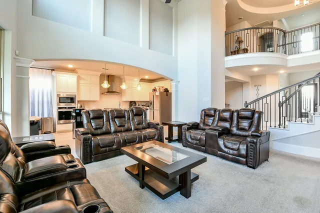 a living room with furniture and a table