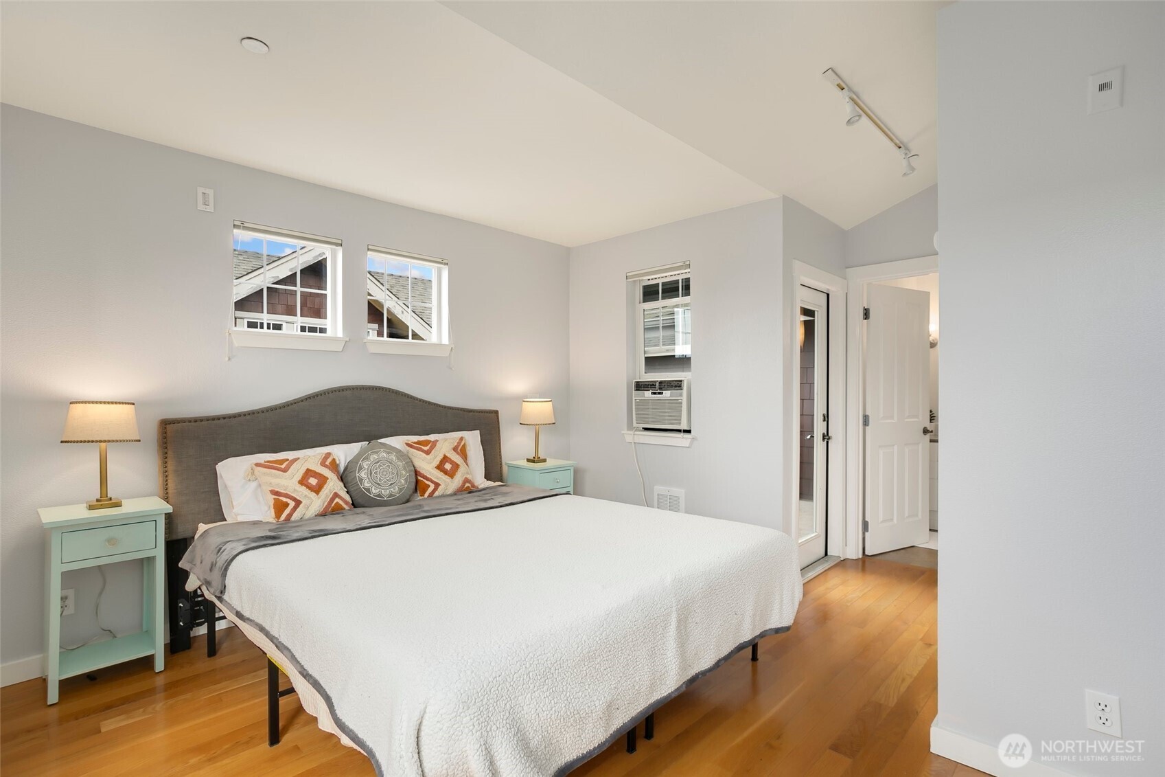 5430 California Avenue Southwest, Unit 3A Seattle, WA 98136 - Photo 12 of 32 a bedroom with a bed and a night stand