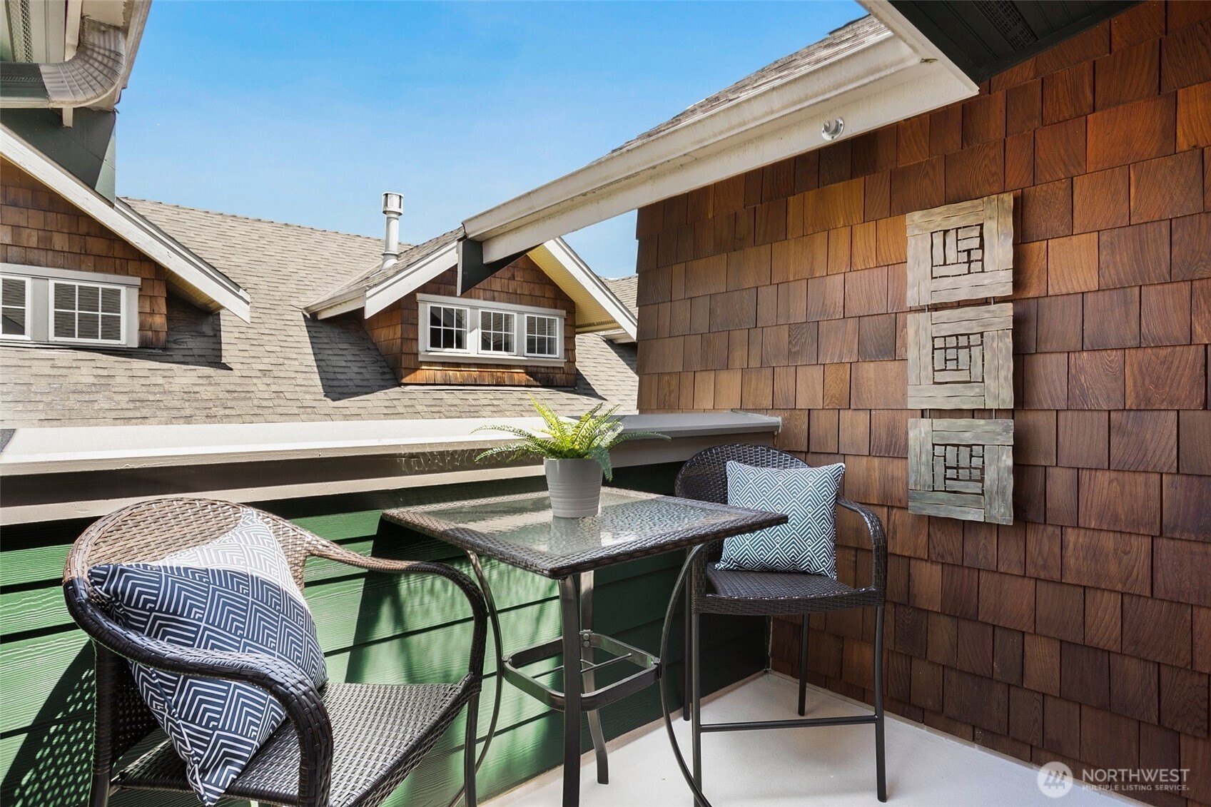 5430 California Avenue Southwest, Unit 3A Seattle, WA 98136 - Photo 25 of 32 a backyard of a house with table and chairs