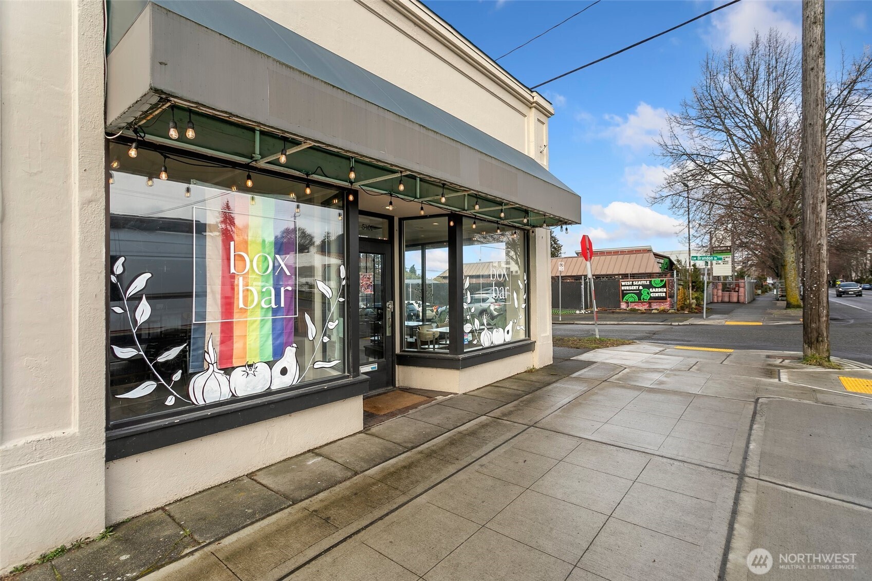 5430 California Avenue Southwest, Unit 3A Seattle, WA 98136 - Photo 29 of 32 a view of path along with retail shop and buildings