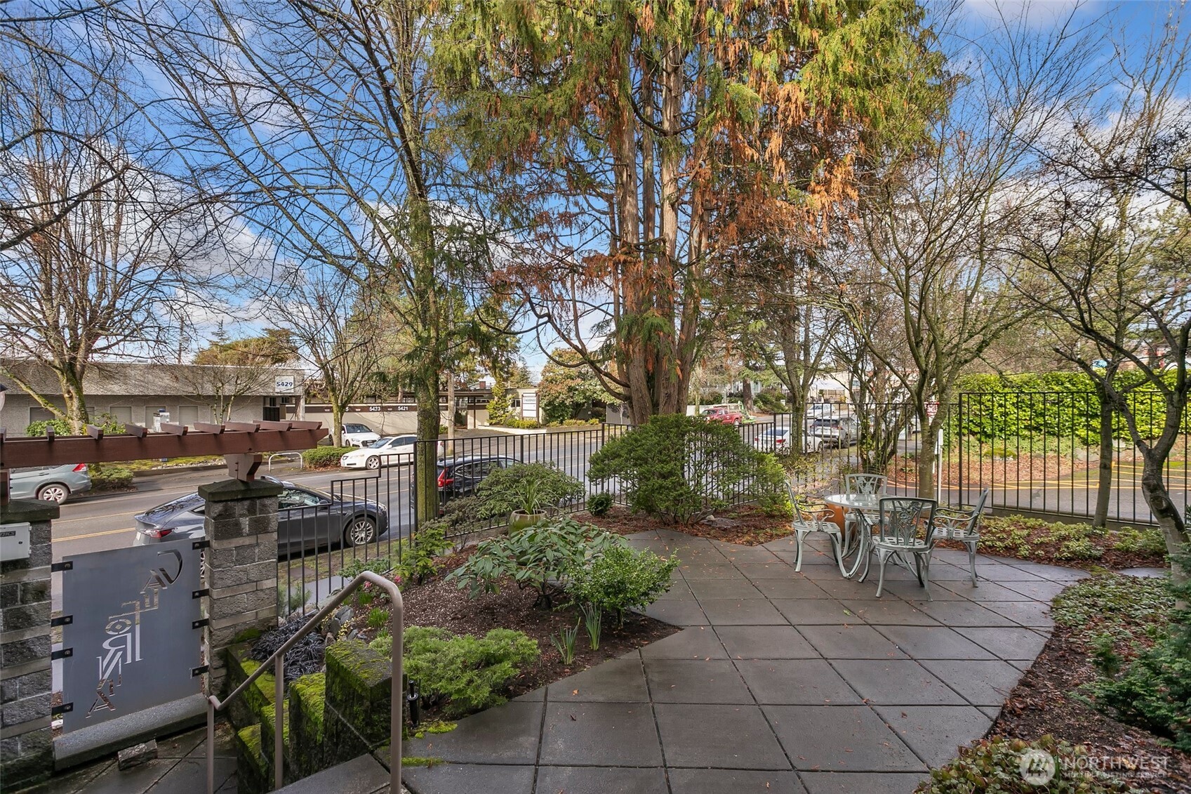 5430 California Avenue Southwest, Unit 3A Seattle, WA 98136 - Photo 3 of 32 a view of backyard with a table and chairs and potted plants