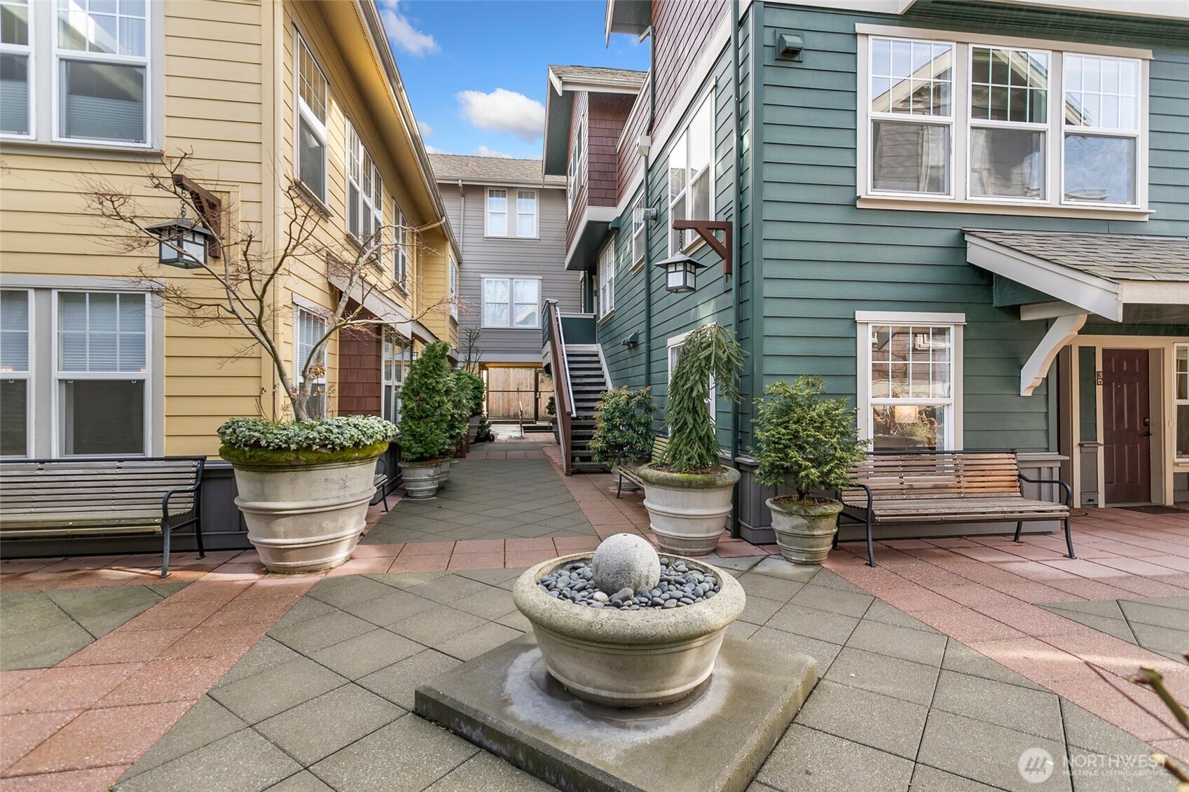 5430 California Avenue Southwest, Unit 3A Seattle, WA 98136 - Photo 5 of 32 a view of a patio with a chairs and a potted plant