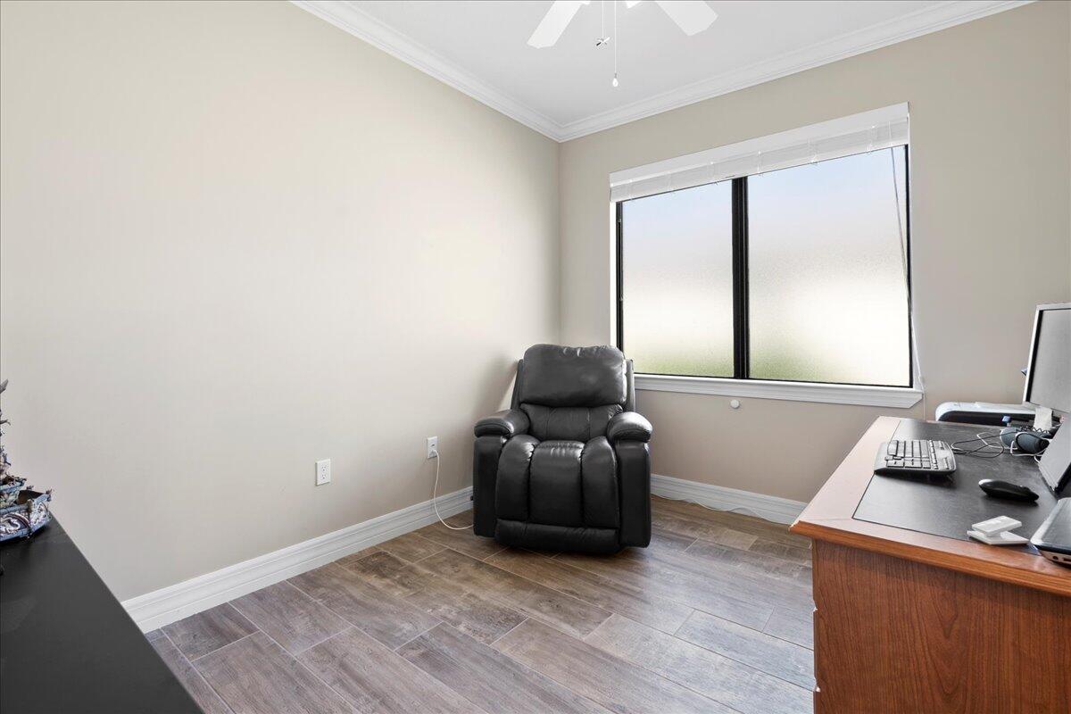 8311 Pedigree Circle Lake Worth, FL 33467 - Photo 18 of 37 a room with furniture and a window