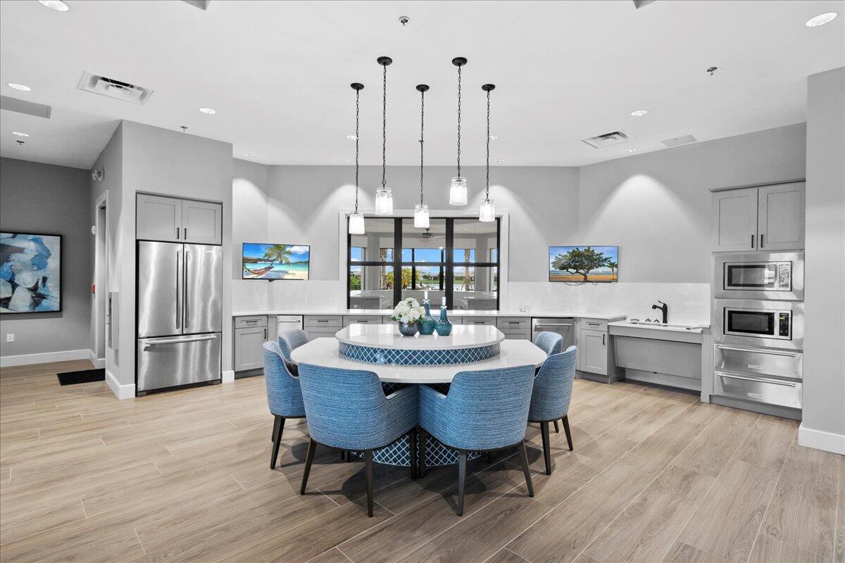 8311 Pedigree Circle Lake Worth, FL 33467 - Photo 23 of 37 a view of a dining room with furniture window and wooden floor