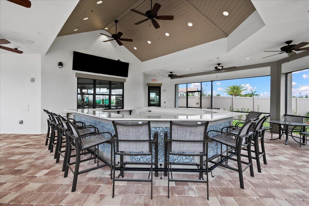 8311 Pedigree Circle Lake Worth, FL 33467 - Photo 24 of 37 a dining room with furniture and window