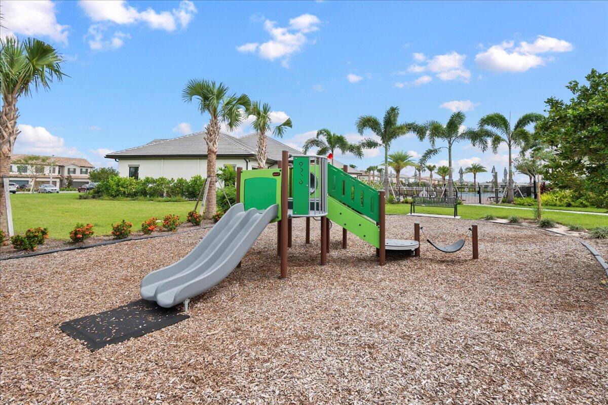 8311 Pedigree Circle Lake Worth, FL 33467 - Photo 26 of 37 a swimming pool with barbeque oven outdoor seating and yard