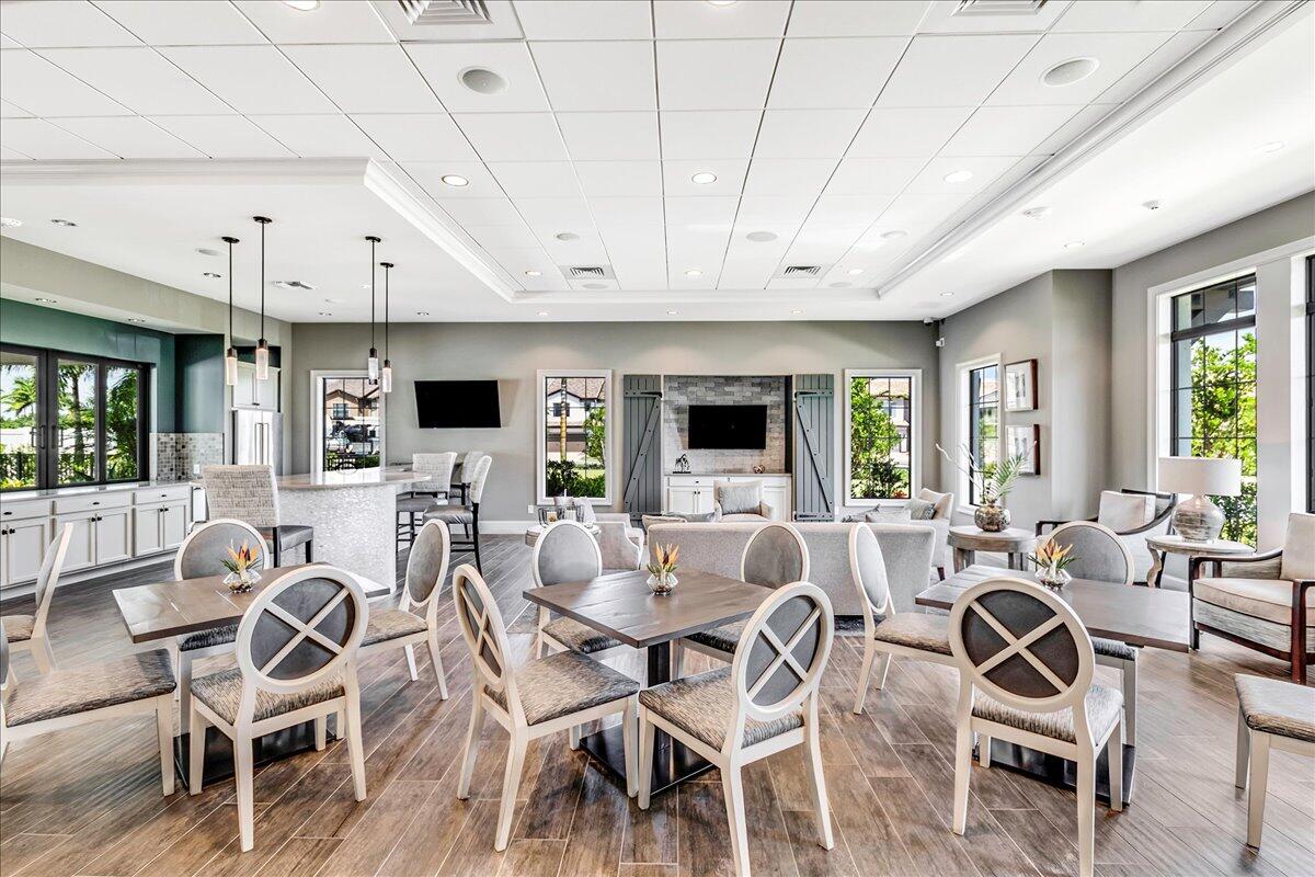 8311 Pedigree Circle Lake Worth, FL 33467 - Photo 32 of 37 a view of a dining room with furniture window and outside view