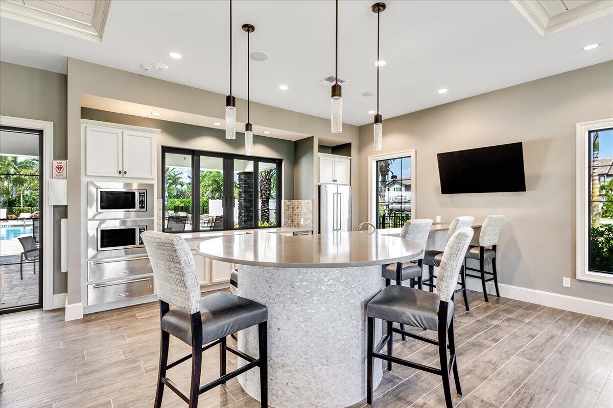 8311 Pedigree Circle Lake Worth, FL 33467 - Photo 34 of 37 a view of kitchen with furniture and a flat screen tv