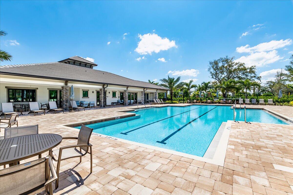 8311 Pedigree Circle Lake Worth, FL 33467 - Photo 36 of 37 a view of house with swimming pool outdoor seating