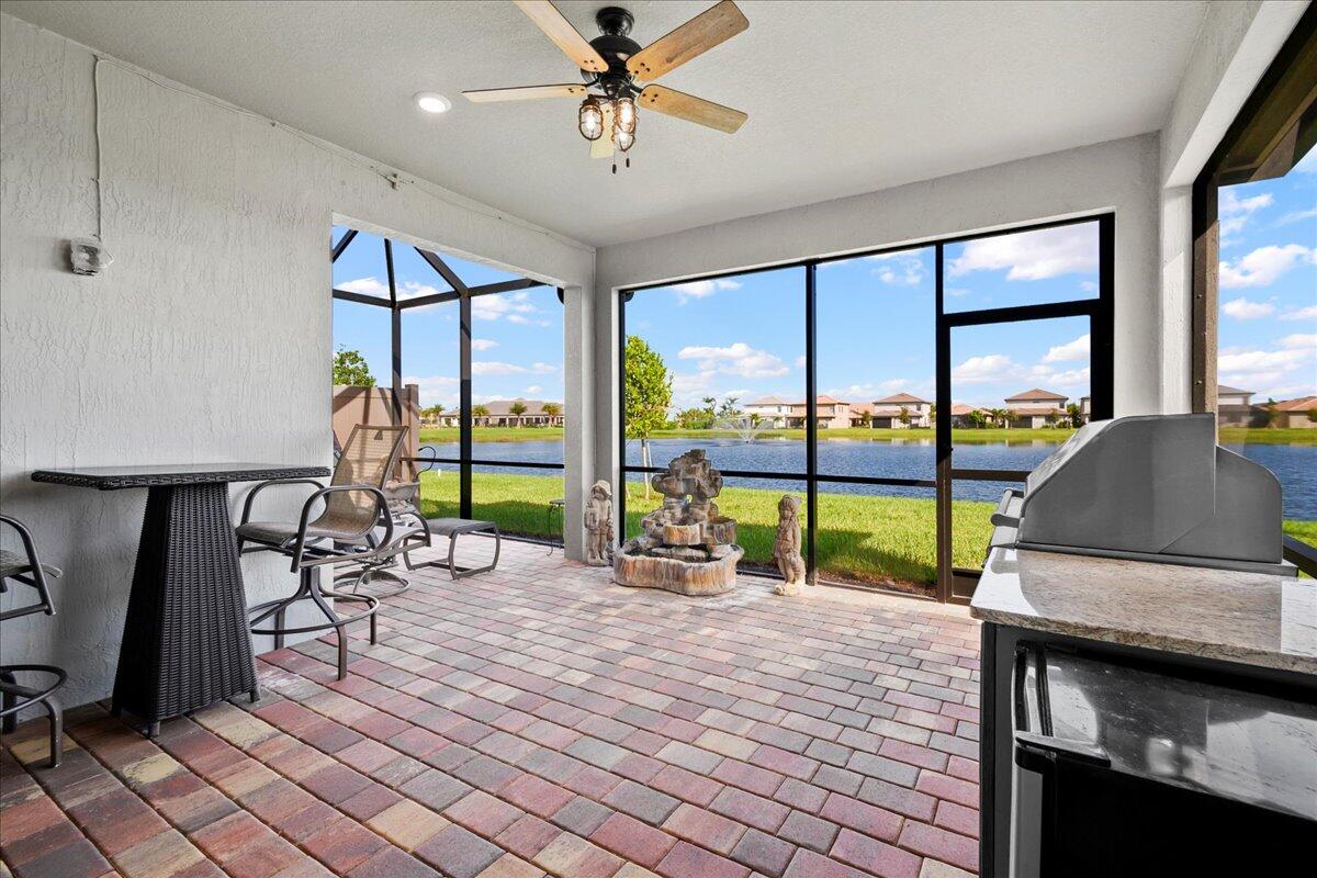 8311 Pedigree Circle Lake Worth, FL 33467 - Photo 4 of 37 a living room filled with furniture and a floor to ceiling window