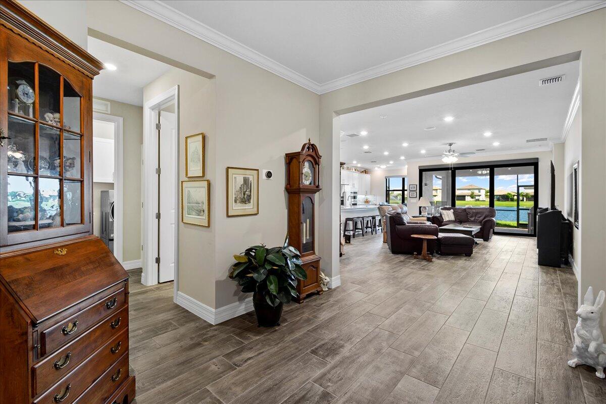 8311 Pedigree Circle Lake Worth, FL 33467 - Photo 8 of 37 a living room with furniture and a flat screen tv