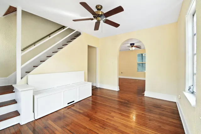 a view of an entryway with wooden floor