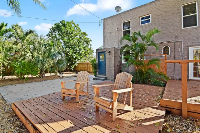 a view of a tables and chairs on the roof deck