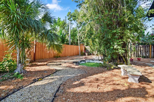 a view of a backyard with chairs