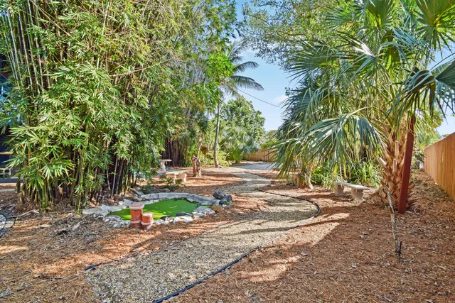 a view of a backyard of the house