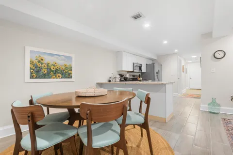 a dining room with furniture and window