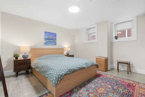 a bedroom with a bed and a couch