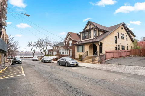 a car parked in front of white house