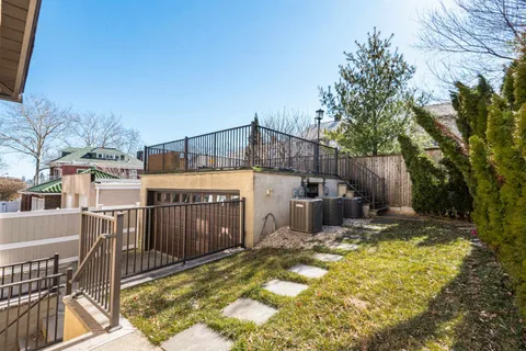 a view of a house with backyard outdoor seating area