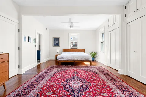 a bedroom with furniture and a window