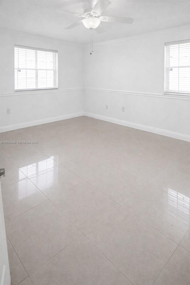 14964 Southwest 32nd Terrace Miami, FL 33185 - Photo 4 of 10 an empty room with a window