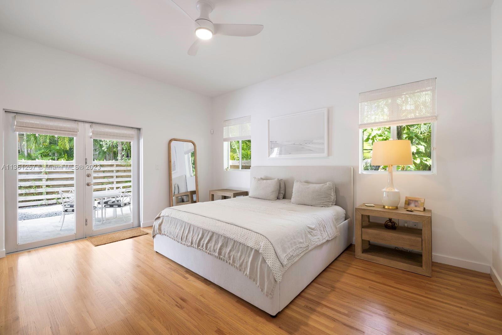 3894 Main Highway Coconut Grove, FL 33133 - Photo 12 of 28 a bedroom with a bed next to a window with outer view