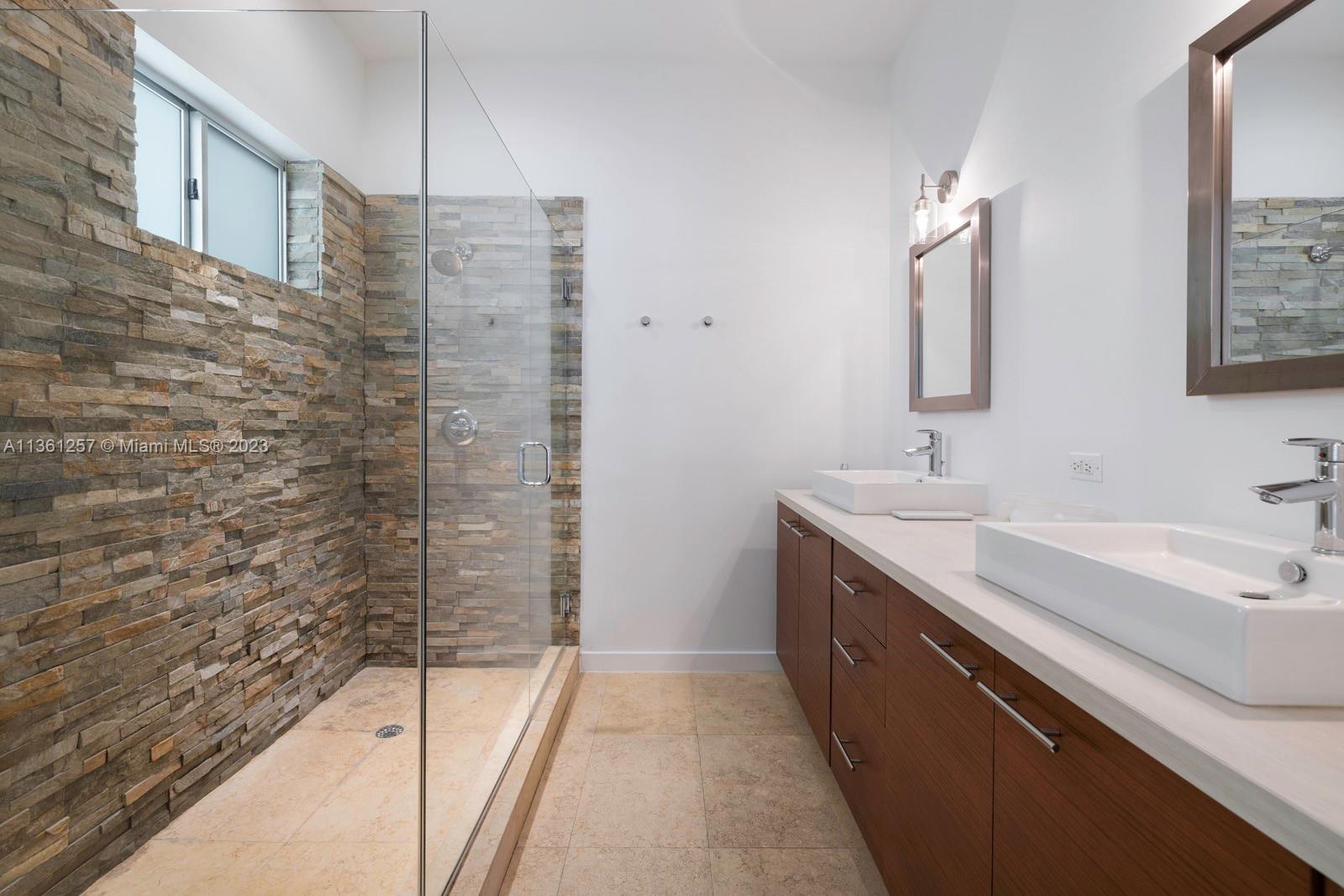 3894 Main Highway Coconut Grove, FL 33133 - Photo 14 of 28 a view of bathroom with a sink and mirror