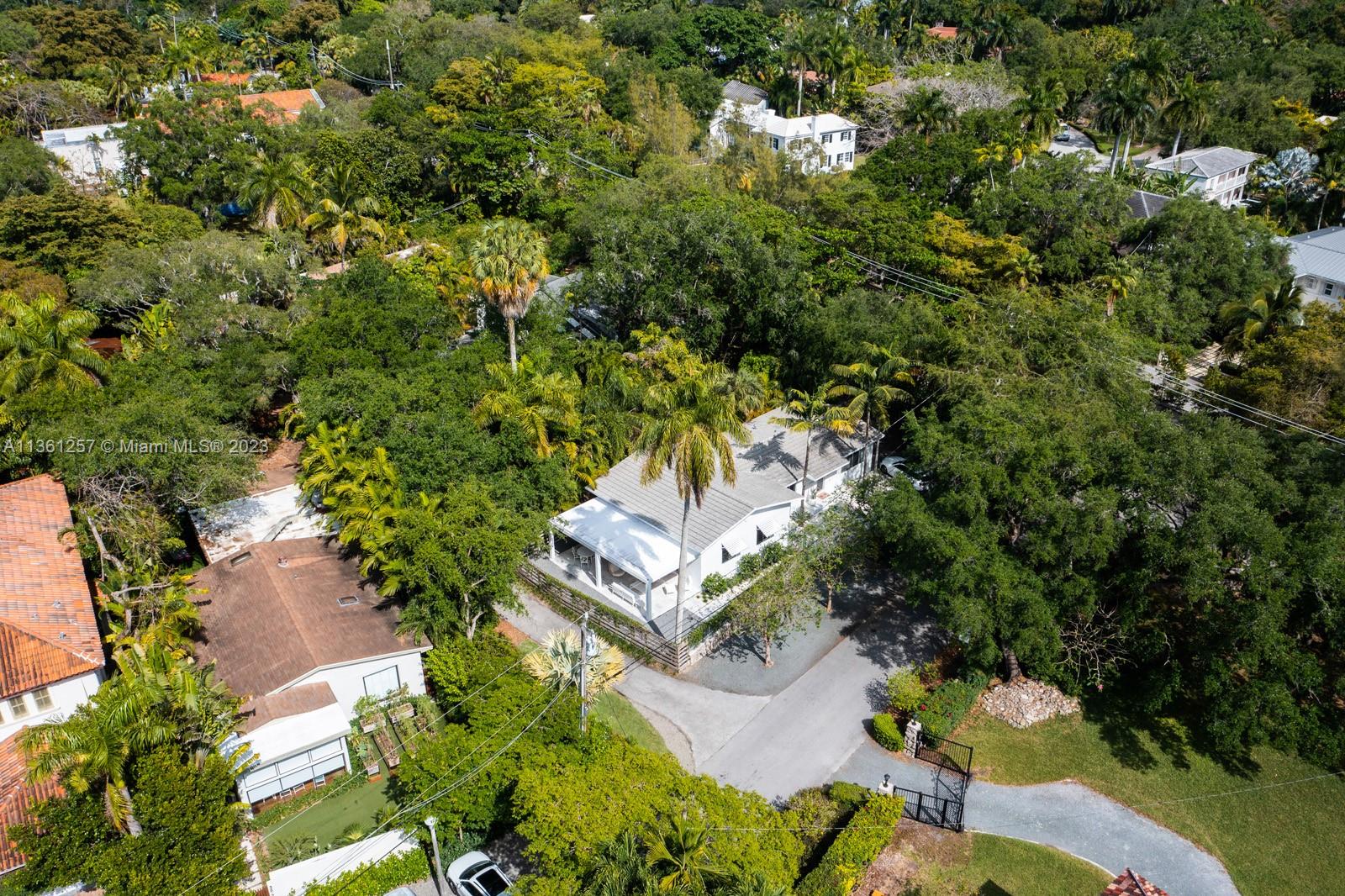 3894 Main Highway Coconut Grove, FL 33133 - Photo 23 of 28 an aerial view of a house with a yard