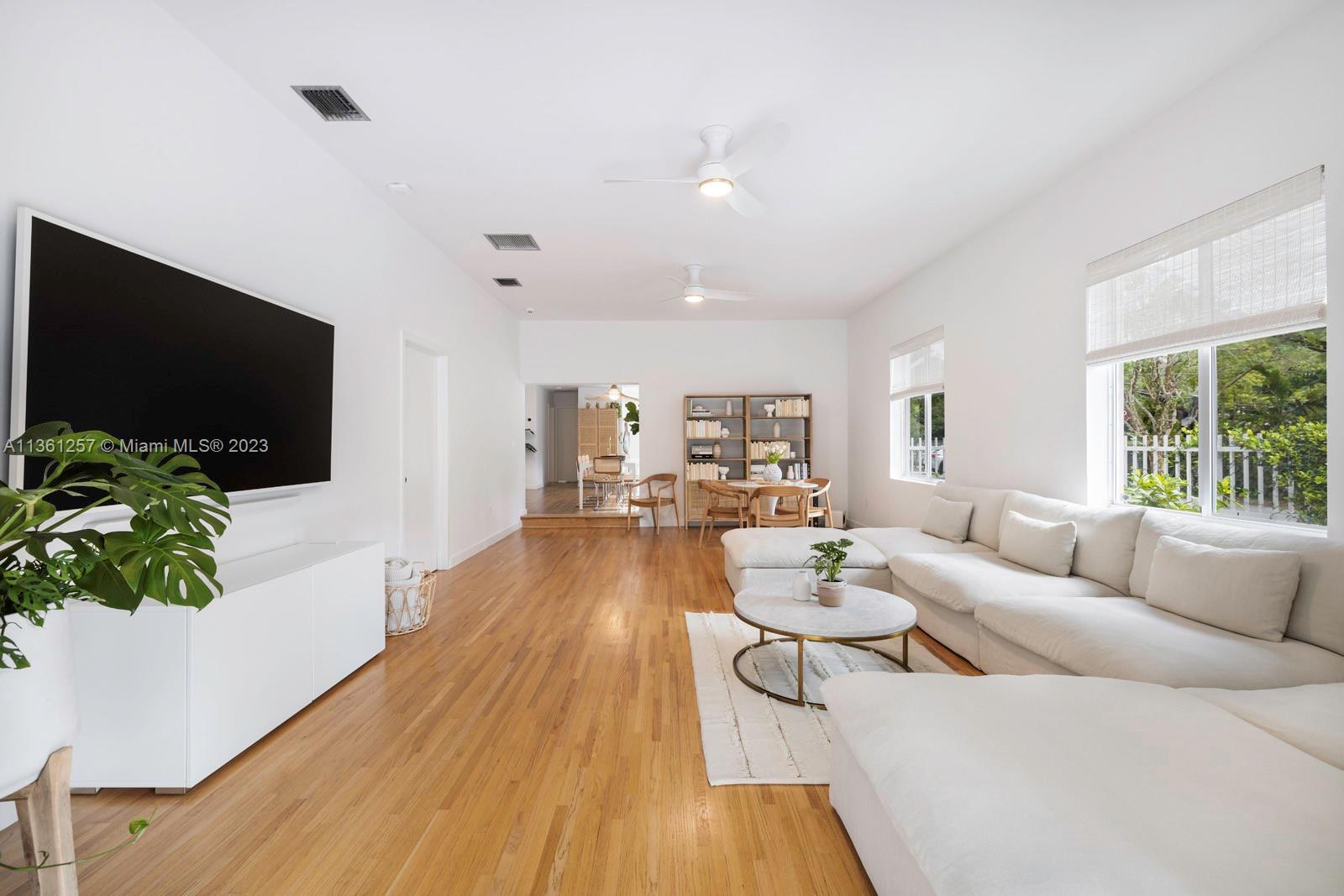 3894 Main Highway Coconut Grove, FL 33133 - Photo 3 of 28 a living room with furniture and a flat screen tv