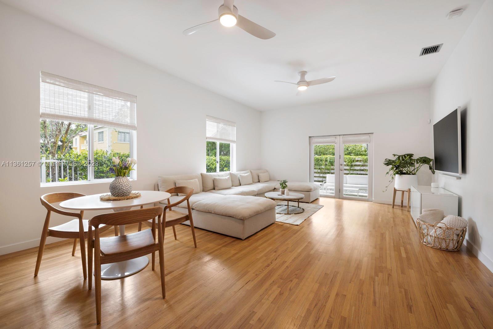 3894 Main Highway Coconut Grove, FL 33133 - Photo 4 of 28 a view of a livingroom with furniture window and wooden floor
