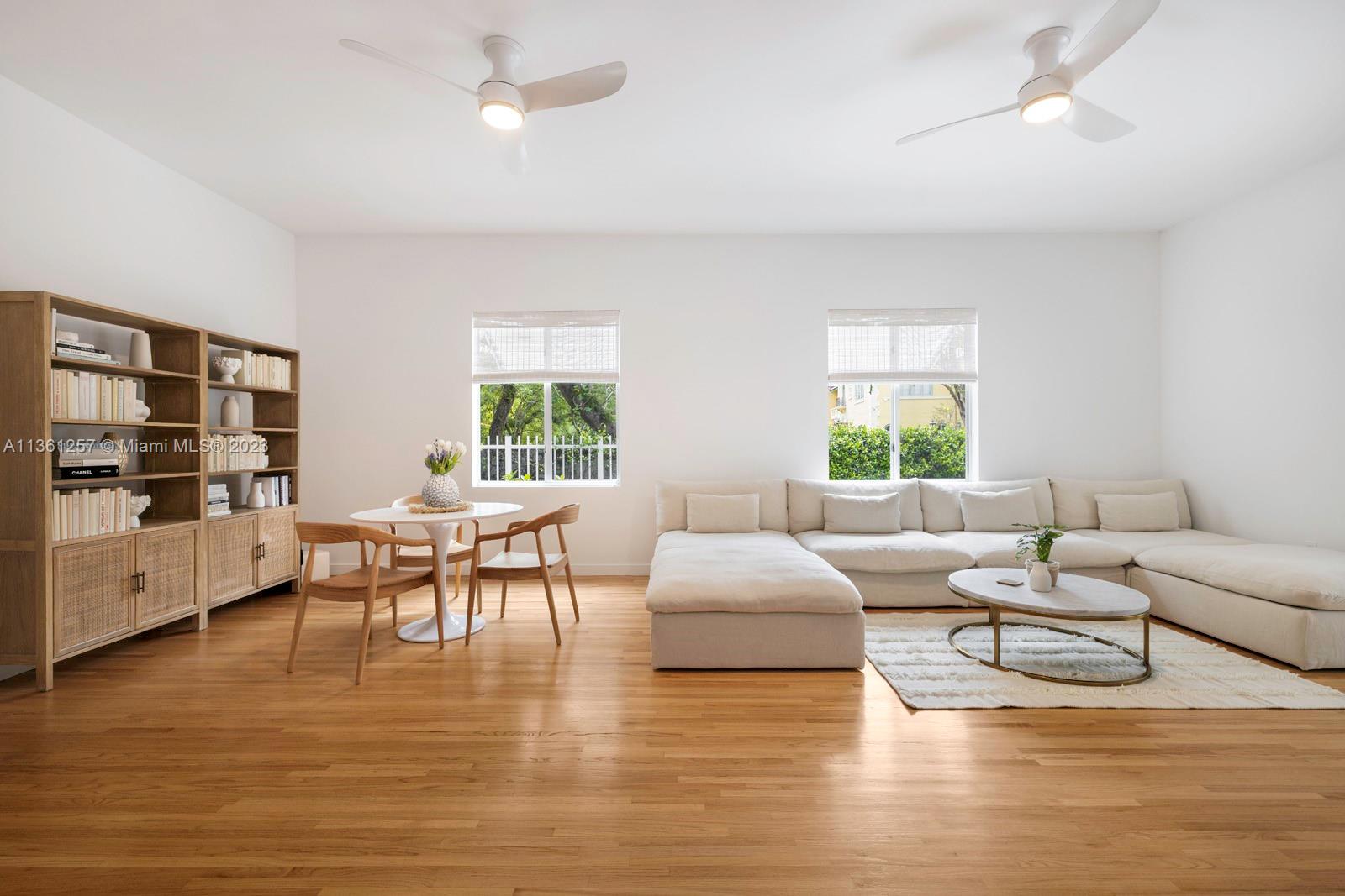 3894 Main Highway Coconut Grove, FL 33133 - Photo 5 of 28 a living room with furniture and a large window
