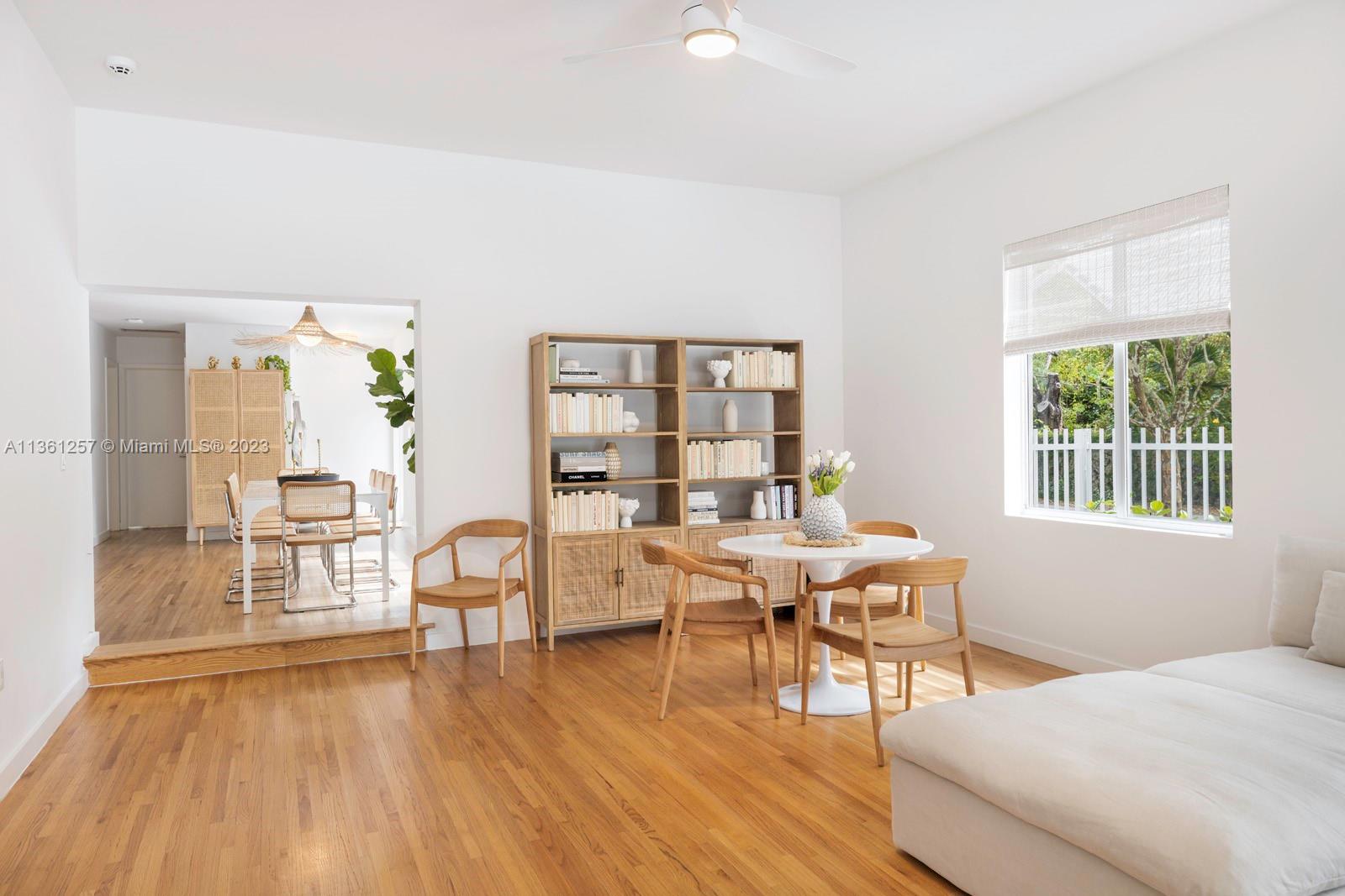 3894 Main Highway Coconut Grove, FL 33133 - Photo 6 of 28 a view of a dining room with furniture and wooden floor