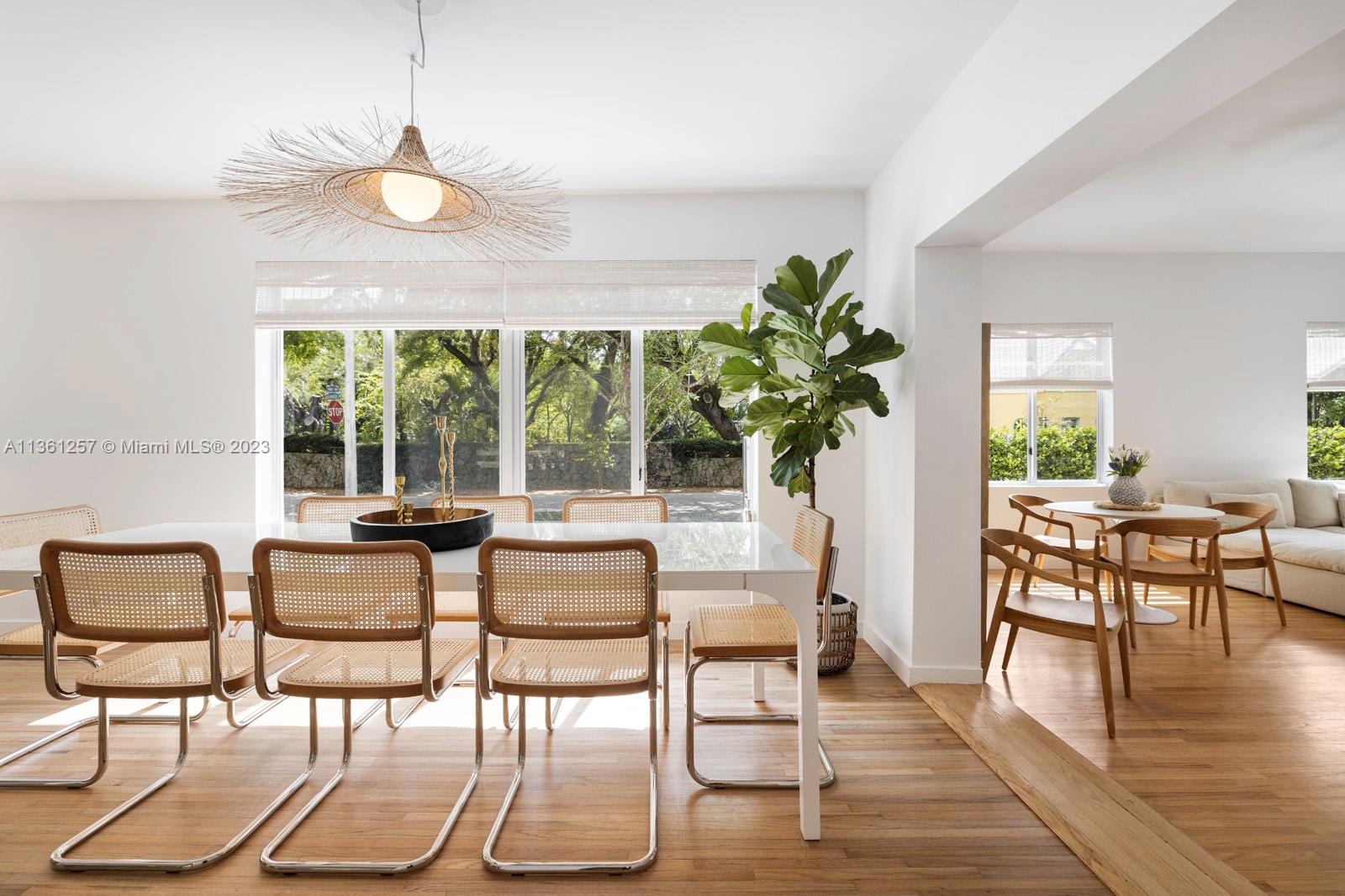 3894 Main Highway Coconut Grove, FL 33133 - Photo 7 of 28 a view of a dining room with furniture window and wooden floor